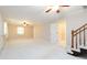 Large living room with hardwood stairs and open floor plan at 2343 Kings Point Dr, Dunwoody, GA 30338