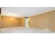 Open living room with tan walls, white carpeting, chandelier, and neutral trim at 2343 Kings Point Dr, Dunwoody, GA 30338