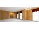 Open living space with neutral walls, neutral carpet, chandelier, and natural lighting at 2343 Kings Point Dr, Dunwoody, GA 30338