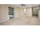 Spacious basement with carpet, ceiling fan, and doorway to unfinished area at 2979 Sweetbriar Walk, Snellville, GA 30039