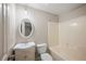 Bathroom with shower-tub combination, oval mirror and sink at 2979 Sweetbriar Walk, Snellville, GA 30039