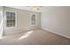 Bedroom featuring carpet, ceiling fan and two windows providing natural light at 2979 Sweetbriar Walk, Snellville, GA 30039