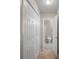 Hallway view to bathroom with closet and door at 2979 Sweetbriar Walk, Snellville, GA 30039