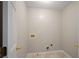 Bright laundry room featuring white marble floors and washer-dryer hookups at 2979 Sweetbriar Walk, Snellville, GA 30039