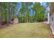 Spacious backyard with mature trees, a shed, and plenty of room for outdoor activities at 4960 Shannon Sw Way, Mableton, GA 30126