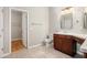 Bathroom featuring a vanity with a makeup counter and a walk-in closet at 4960 Shannon Sw Way, Mableton, GA 30126