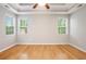 A bright bedroom with hardwood floors and two windows offering natural light at 4960 Shannon Sw Way, Mableton, GA 30126