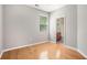 Bedroom with hardwood flooring and a view to an ensuite bathroom at 4960 Shannon Sw Way, Mableton, GA 30126