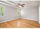 A spacious bedroom features a ceiling fan, hardwood floors, and natural light at 4960 Shannon Sw Way, Mableton, GA 30126