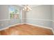 Dining room featuring hardwood floors, a modern chandelier, and natural light at 4960 Shannon Sw Way, Mableton, GA 30126