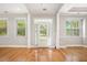 Elegant entryway with natural light, hardwood floors, and well-defined architectural details at 4960 Shannon Sw Way, Mableton, GA 30126