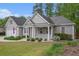 Charming single-story home featuring a manicured lawn, attached garage, and covered front porch at 4960 Shannon Sw Way, Mableton, GA 30126