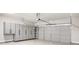 Garage featuring storage cabinets and drawers along with a full, paneled garage door at 4960 Shannon Sw Way, Mableton, GA 30126