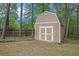 Storage shed with barn doors and a fenced yard at 4960 Shannon Sw Way, Mableton, GA 30126