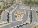 Aerial view of the townhouse community, showcasing the landscaping and surrounding roadways at 1041 Cherryfield Run, Marietta, GA 30008
