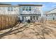 The backyard is enclosed with a wood fence, a seating area, and an area for grilling at 1041 Cherryfield Run, Marietta, GA 30008