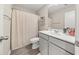 This bathroom features a vanity with a sink, toilet, and a shower with a shower curtain at 1041 Cherryfield Run, Marietta, GA 30008