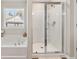 Bright bathroom features a soaking tub and glass-enclosed shower at 1041 Cherryfield Run, Marietta, GA 30008