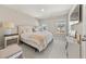 Bright bedroom with neutral colors, carpet and white furniture next to a light-filled window at 1041 Cherryfield Run, Marietta, GA 30008