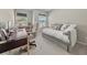This bedroom has a desk, chair, and sofa next to a window, making it a cozy space at 1041 Cherryfield Run, Marietta, GA 30008