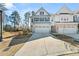 Charming two-story home with symmetrical facade, double garage, driveway and manicured lawn in a suburban neighborhood at 1041 Cherryfield Run, Marietta, GA 30008