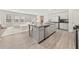 Spacious, open-concept kitchen featuring a large island, modern appliances, and seamless flow into the living area at 1041 Cherryfield Run, Marietta, GA 30008