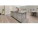 Open-concept kitchen with a large central island, stainless steel appliances, and a seamless transition to the living space at 1041 Cherryfield Run, Marietta, GA 30008