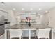 Bright kitchen featuring a spacious island with bar seating, stainless appliances, and neutral color palette at 1041 Cherryfield Run, Marietta, GA 30008