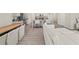 Open-concept living space with modern kitchen, dining area, and comfortable living room with white sofa at 1041 Cherryfield Run, Marietta, GA 30008