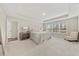 Spacious main bedroom features tray ceilings, plush carpet, large windows, and stylish furniture at 1041 Cherryfield Run, Marietta, GA 30008