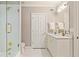 Elegant bathroom with glass-enclosed shower, marble vanity, and gold fixtures at 1061 Arbor Ne Trce, Atlanta, GA 30319