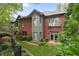 Brick home exterior featuring a manicured lawn and charming architectural details at 1061 Arbor Ne Trce, Atlanta, GA 30319
