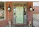 Close-up of the front door showcasing sidelights, transom window and decorative lion statues at 1061 Arbor Ne Trce, Atlanta, GA 30319