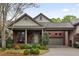 Charming brick home featuring a covered front porch, portico, and well-manicured landscaping at 1061 Arbor Ne Trce, Atlanta, GA 30319