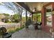 Inviting covered porch with brick flooring and comfortable seating with a view of the neighborhood at 1061 Arbor Ne Trce, Atlanta, GA 30319