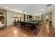 Large game room with pool table, hardwood floors, and classic furnishings at 1061 Arbor Ne Trce, Atlanta, GA 30319