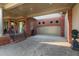 Brick home showcasing an attached garage with a porte-cochere and brick-paved driveway at 1061 Arbor Ne Trce, Atlanta, GA 30319