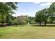 Scenic view of community green space with a lake, fountain, and walking path at 1061 Arbor Ne Trce, Atlanta, GA 30319