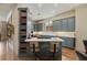 Stylish kitchen island with bar seating, custom cabinets, and modern appliances at 1061 Arbor Ne Trce, Atlanta, GA 30319