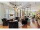 Bright living room with large windows, cozy seating, and hardwood floors at 1061 Arbor Ne Trce, Atlanta, GA 30319