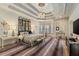 Luxurious main bedroom featuring a tray ceiling, chandelier, and hardwood floors at 1061 Arbor Ne Trce, Atlanta, GA 30319