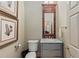 Stylish powder room with marble countertop vanity and decorative artwork at 1061 Arbor Ne Trce, Atlanta, GA 30319