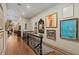 Bright hallway with hardwood floors, a staircase, and decorative wall art at 1061 Arbor Ne Trce, Atlanta, GA 30319