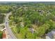 Bird's-eye view of a home in a quiet, tree-filled neighborhood with roads nearby at 2972 Nw Stilesboro Nw Rd, Kennesaw, GA 30152