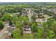 Aerial image showcasing a lovely home tucked away in a lush green neighborhood with mature trees at 2972 Nw Stilesboro Nw Rd, Kennesaw, GA 30152