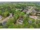 Aerial view of home showcases its location within a quiet, tree-filled community at 2972 Nw Stilesboro Nw Rd, Kennesaw, GA 30152