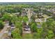 Beautiful aerial view of home nestled in a lush, green neighborhood with mature trees at 2972 Nw Stilesboro Nw Rd, Kennesaw, GA 30152