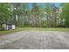 Spacious backyard featuring a shed and a concrete pad, ready for outdoor activities at 2972 Nw Stilesboro Nw Rd, Kennesaw, GA 30152