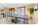 Basement featuring ping pong table, window, and an abundance of storage space at 2972 Nw Stilesboro Nw Rd, Kennesaw, GA 30152