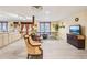 Finished basement with ping pong table, seating, tv, and snack area with cabinetry at 2972 Nw Stilesboro Nw Rd, Kennesaw, GA 30152